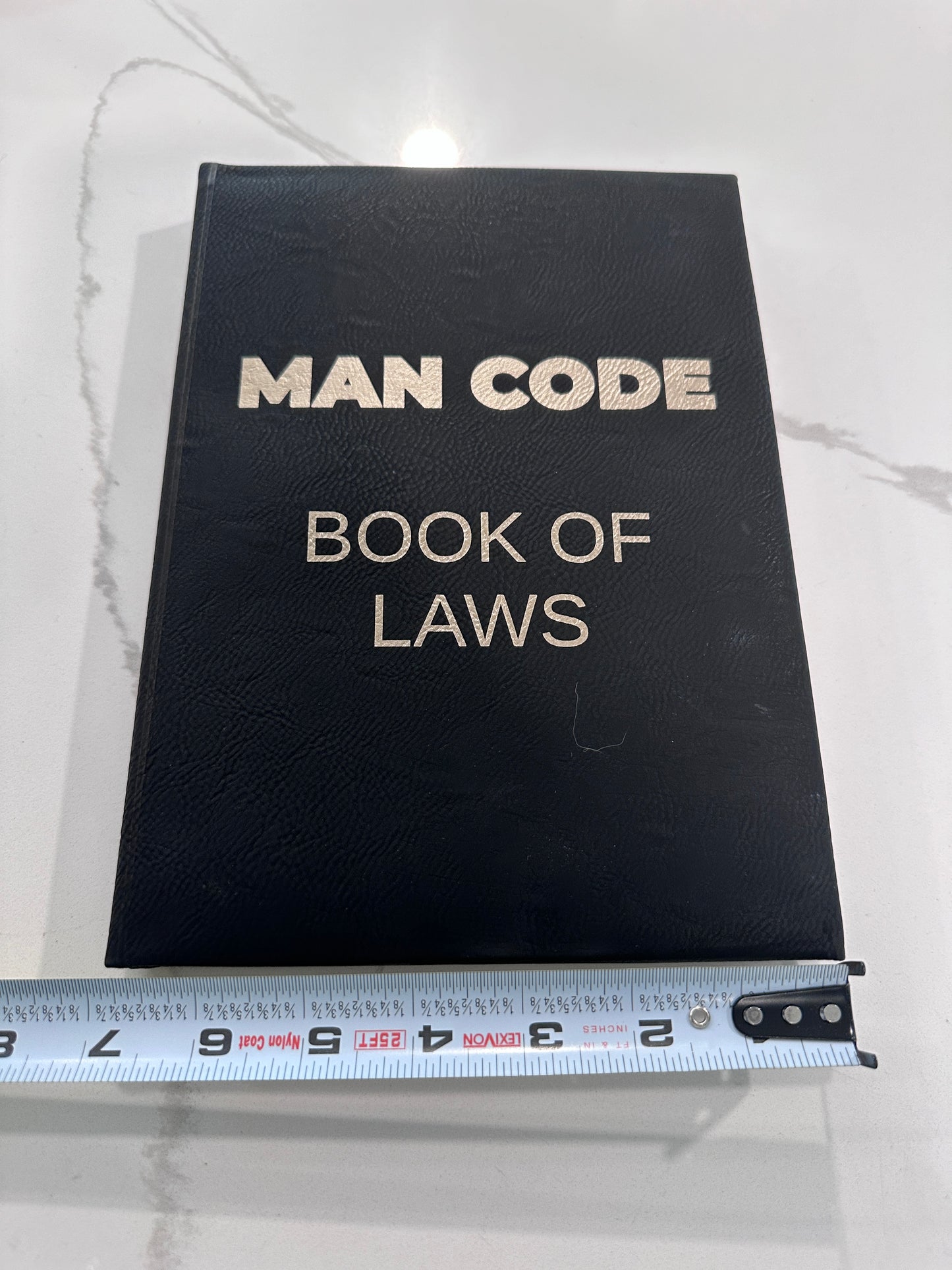 The Man Code Book of Laws Leather-bound journal