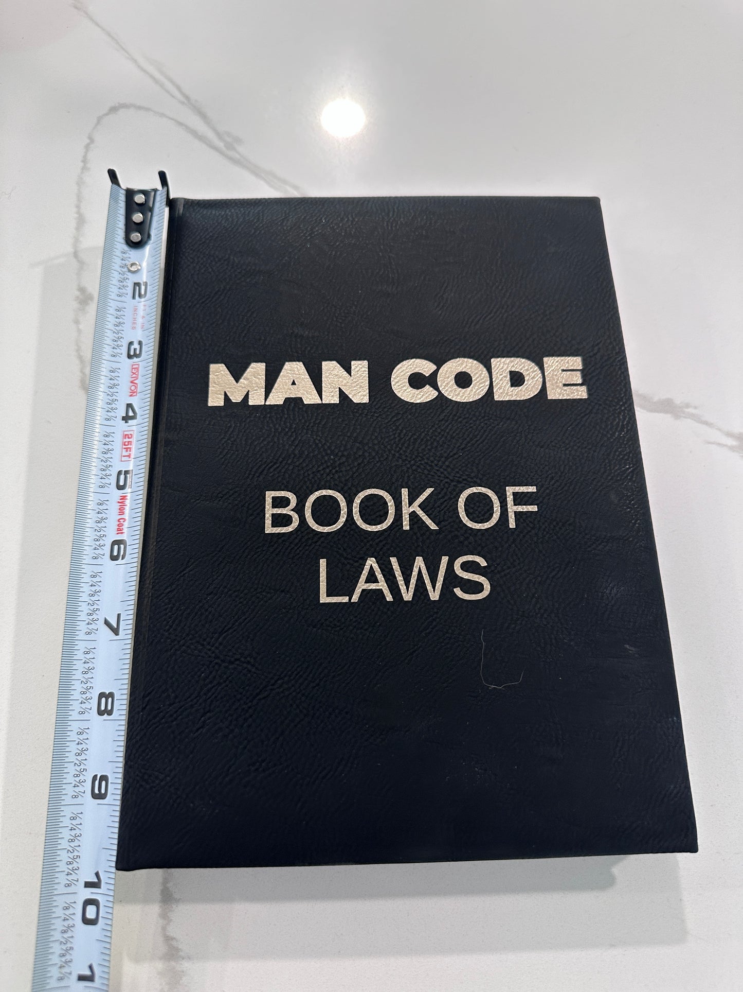 The Man Code Book of Laws Leather-bound journal